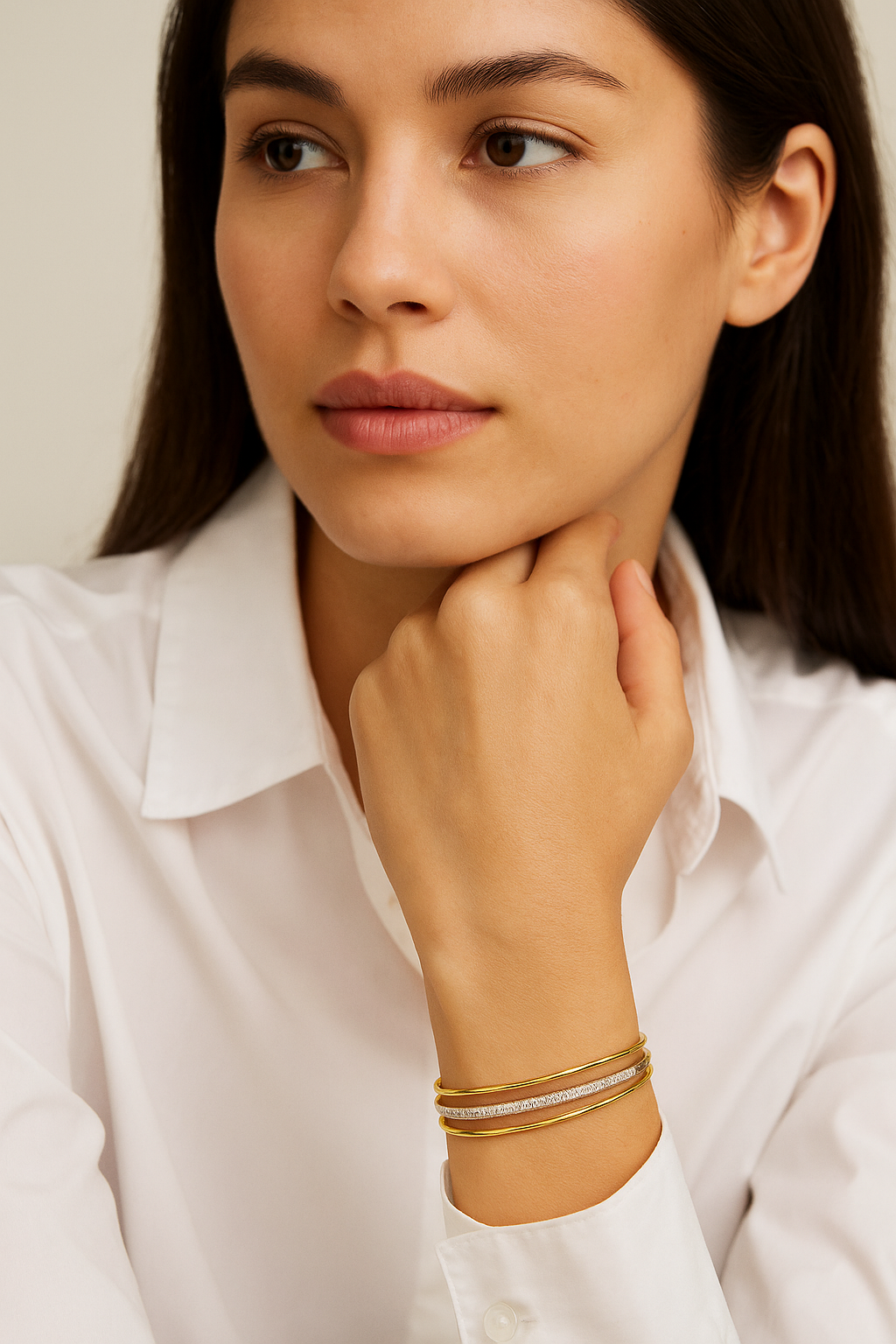 A refined take on a classic silhouette, the Diamond Twist Bangle is crafted in solid 18K gold and set with natural diamonds. The sculpted twist design adds a modern edge, while the adjustable fit ensures comfort and ease of wear.
Available in yellow gold, white gold, and rose gold, this piece is perfect worn alone or stacked for a layered look. on model