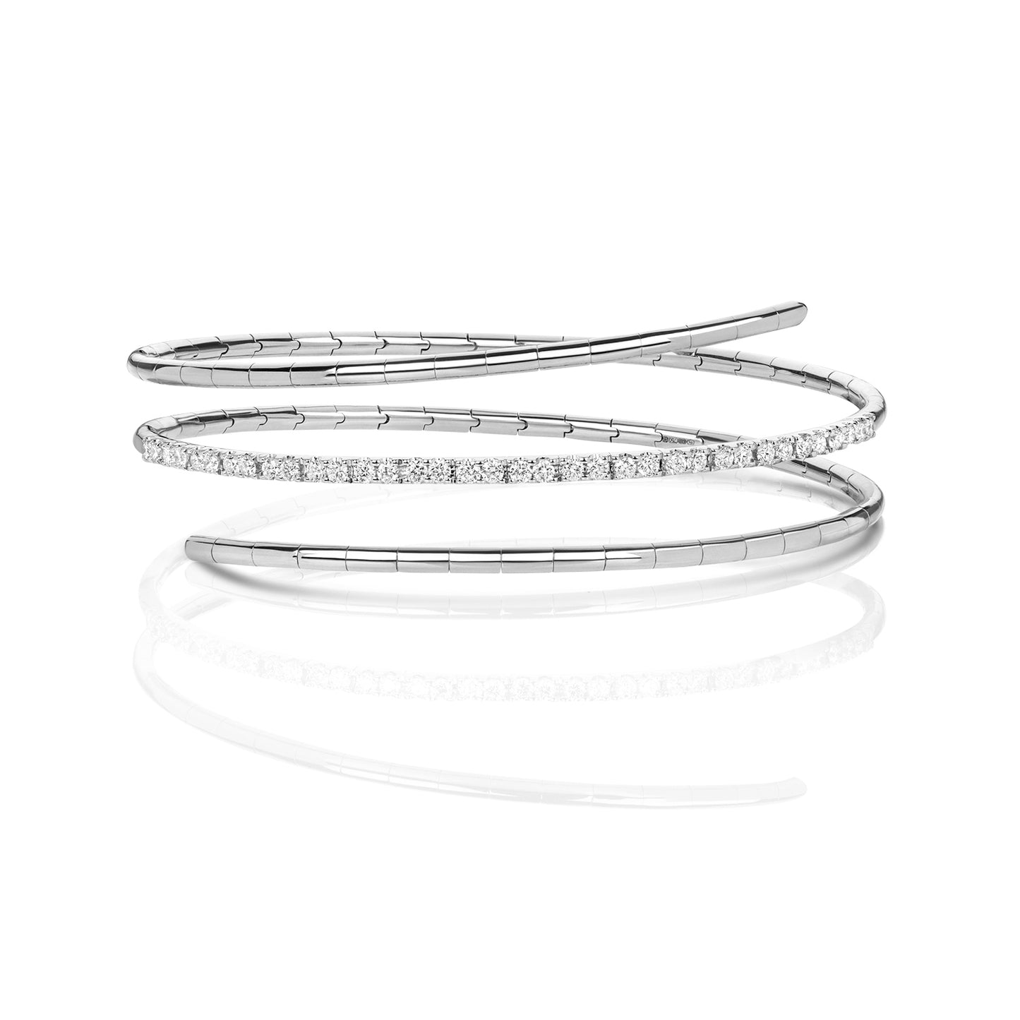 A refined take on a classic silhouette, the Diamond Twist Bangle is crafted in solid 18K gold and set with natural diamonds. The sculpted twist design adds a modern edge, while the adjustable fit ensures comfort and ease of wear.
Available in yellow gold, white gold, and rose gold, this piece is perfect worn alone or stacked for a layered look.