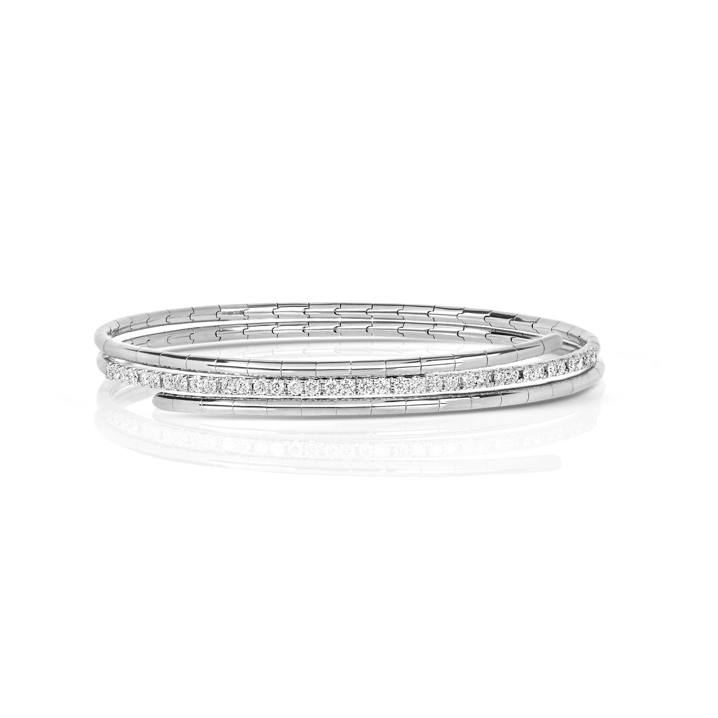 A refined take on a classic silhouette, the Diamond Twist Bangle is crafted in solid 18K gold and set with natural diamonds. The sculpted twist design adds a modern edge, while the adjustable fit ensures comfort and ease of wear.
Available in yellow gold, white gold, and rose gold, this piece is perfect worn alone or stacked for a layered look.